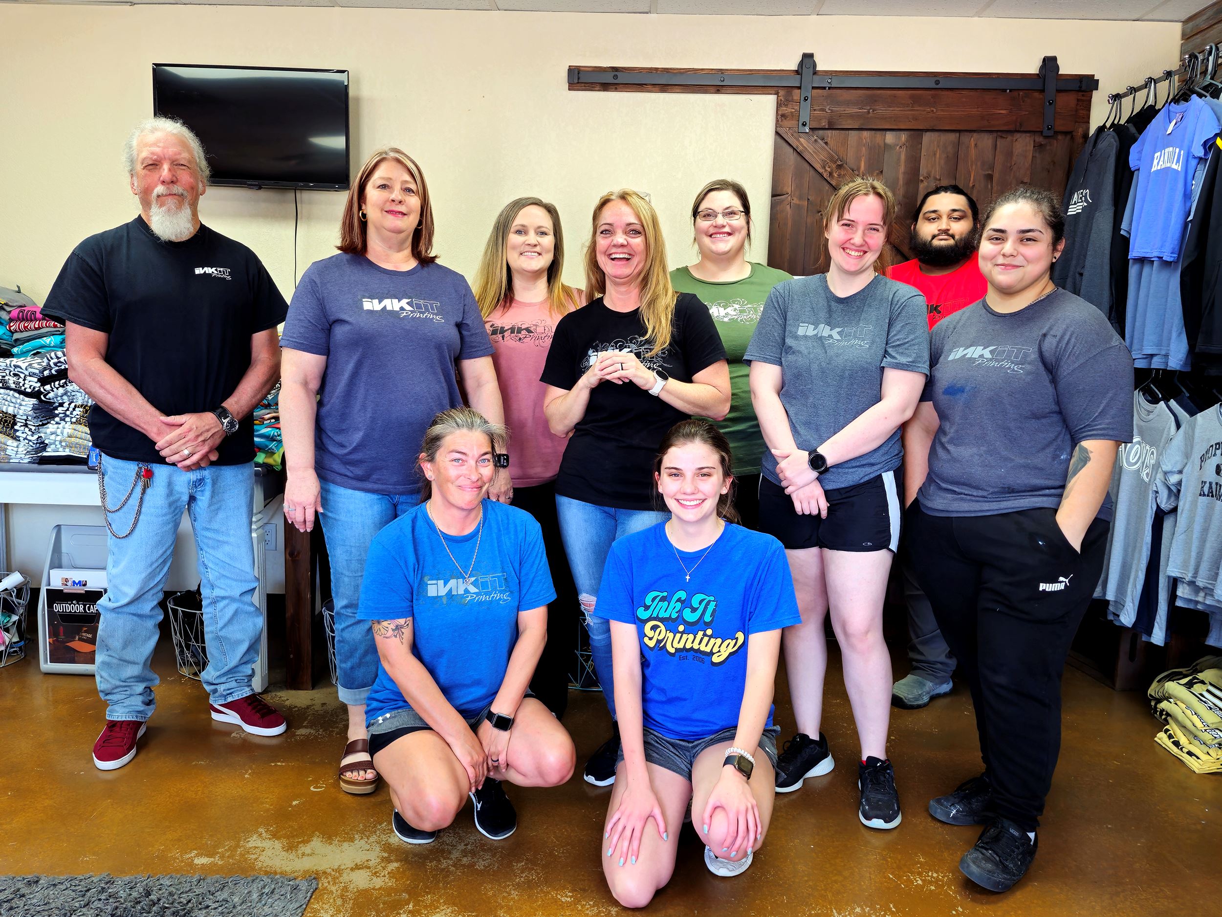 People smiling for an Ink It Printing staff shot 