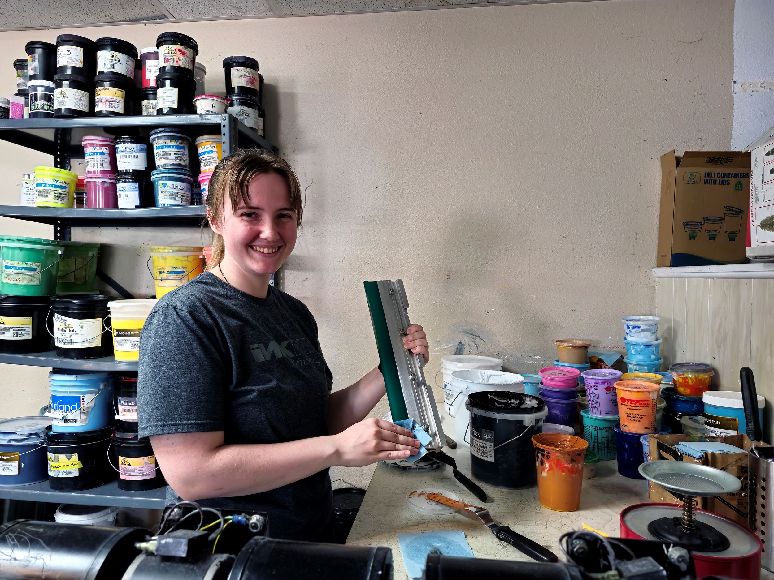 Mixing colors of ink with a smile at Ink It Printing