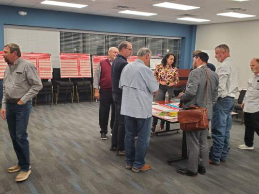 Citizens and staff discuss development at the Envision Crandall Open House in November
